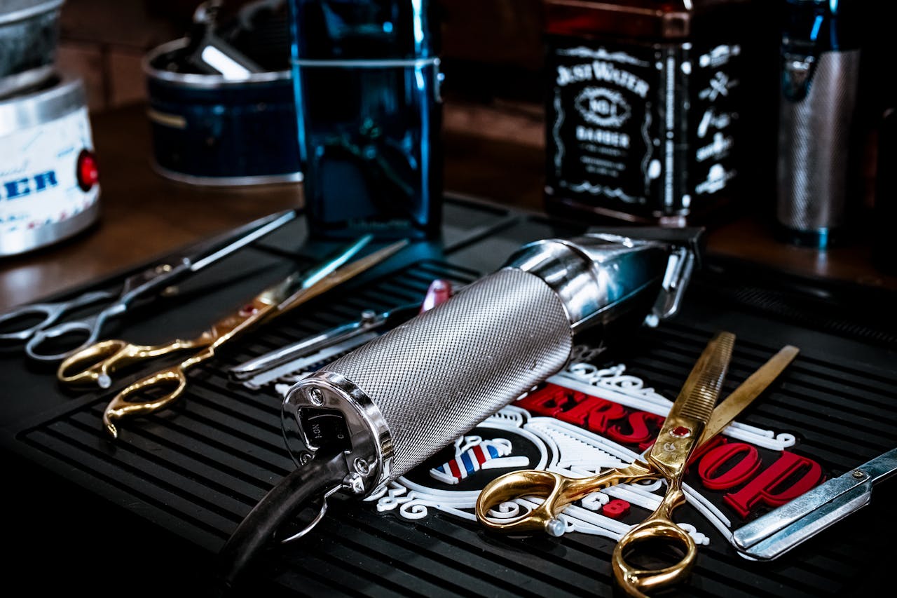 Crafting Captivating Headlines: Your awesome post title goes here A close view of barber tools including scissors and clippers on a shop countertop.